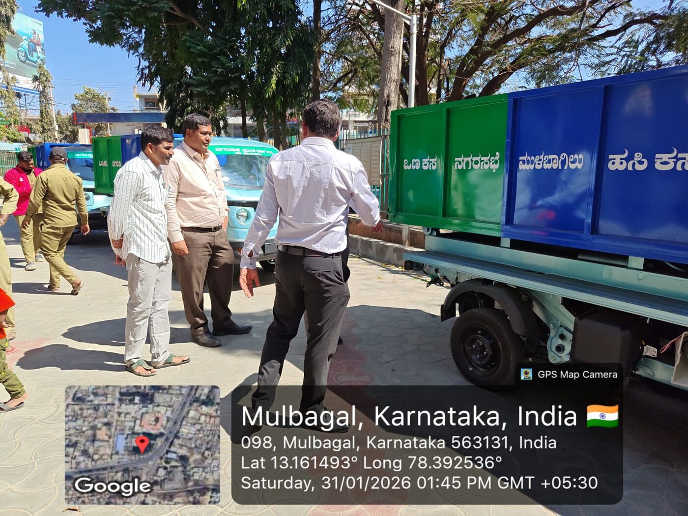 Officials approaching the newly delivered EV fleet